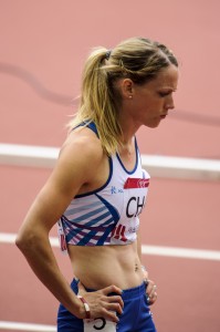 Eilidh Child with hands on hips at Hampden for Glasgow 2014 400m h heats